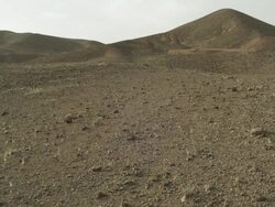 Large hills of North Africa lead down to sparse and loose terrain. Stock Footage