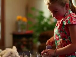 MS Little girl dyeing easter eggs in color water  / Lamy, New Mexico, United States Stock Footage
