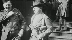 1921 MONTAGE Soldiers of the London Scottish reserve regiment, wearing half uniform and half civilian clothing, congregating and marching on Wimbledon Common, one soldier in a kilt and suit coat / London, England Stock Footage