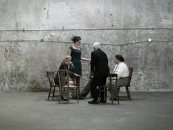 Colleagues sitting in circle, then standing and holding hands Stock Footage