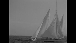 Sailors hang on the sides of their yachts to change direction and prevent capsizing during Chicago race News Clip