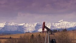 HD TIME LAPSE: Pump Jack Against Mountain Range Stock Footage