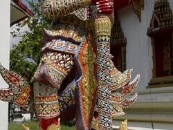MS TU Buddhist temple guardian in wat samret temple (Ko Samui Island) / Wat Samret, Ko Samui, Thailand   Stock Footage
