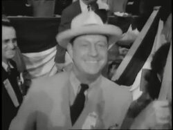 Delegates hold signs for Roosevelt at the 1944 Democratic National Convention. News Clip