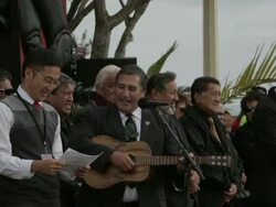 Mid shot of government officials singing and Stock Footage