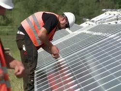 MS Two models fitting instillation screws on line of panels / Howbery, Oxfordshire, United Kingdom Stock Footage