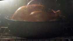 TIME LAPSE CLOSE UP whole turkey cooks in pot in oven with ready button popping up Stock Footage