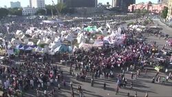 Protesters remove military-installed fences, march on presidential palace Instructional Video