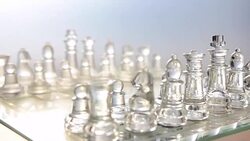 rotation: transparent chess on a glass table Stock Footage