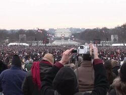 January 18, 2009 WS Spectators watching as large screens show Garth Brooks performing at the 'We Are One' concert on the National Mall to celebrate the inauguration of Barack Obama/ Washington, DC Stock Footage