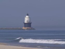 Lighthouse and beach Stock Footage