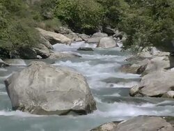CU View of Water of river flowing rapid between mountain / Himalayas, Upper Dolpo, Nepal        Stock Footage