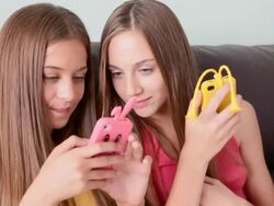 two young girls chatting on mobile phone Stock Footage