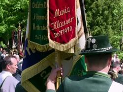 CU Pilgrimage of societies for traditional costumes at abbey Maria Eck near Siegsdorf, Chiemgauer Alps / Siegsdorf, Bavaria, Germany Stock Footage