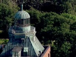 AERIAL MS ZO View of top part of lighthouse / Neuwerk, Schleswig-Holstein, Germany Stock Footage