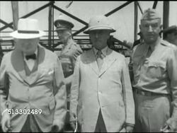 1942: FORT JACKSON REVIEW: MS British Prime Minister Winston Churchill standing for photographs w/ unidentified men, one in safari hat.  Poor quality, damaged, WWII. Instructional Video