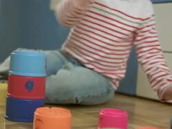 Little Boy Playing With Stack Cups Stock Footage