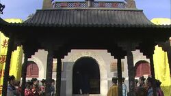 Taoist monks sit near an incense pit. Stock Footage