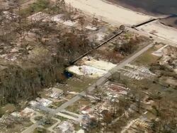 Aerial over destroyed house plots in residential neighborhood / Waveland, Mississippi Stock Footage