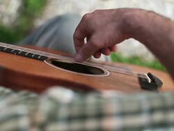 Acoustic guitarist playing chords, close-up Stock Footage