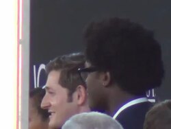 Lucas Neff and Echo Kellum outside the Jobs Stock Footage
