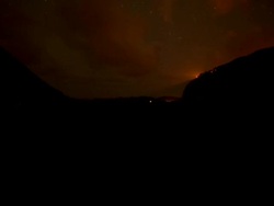 WS T/L View of stars, sunrise, and clouds moving across sky with mountains, trees and landscape / Waipio, Hawaii, United States Stock Footage