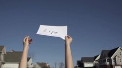 Slow Motion of Tossing Paper With Word 'Life' Stock Footage