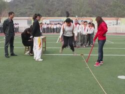 MS School students doing long jump on playground of school/xian,shaanxi,China Stock Footage