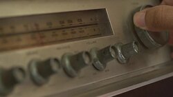 Hand adjusts radio channels recorder Stock Footage