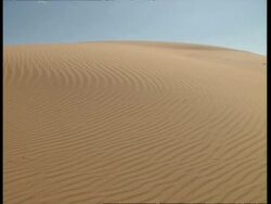 MS Sand dune with wind pattern, against blue sky Stock Footage
