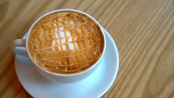 hot caramel macchiato on wood table Stock Footage