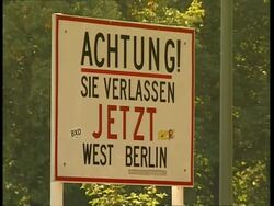 CU Historical sign notifying exit from West Berlin: 'Achtung! Sie Verlassen Jetzt West Berlin' (Warning, You are now leaving West Berlin), Berlin Stock Footage