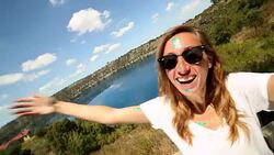 Young woman takes selfie portrait at Blue lake, South Australia Stock Footage