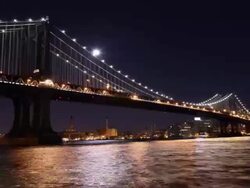  Moon rising over Manhattan Bridge Stock Footage