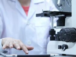 Scientist using microscope Stock Footage