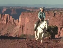 MS ZO Women Galloping Horse through Majestic Red Rock Mountains / Telluride, Colorado, United States    Stock Footage