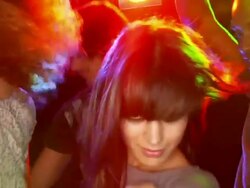 Slow motion close-up two young women dancing, two men dancing nearby in background Stock Footage