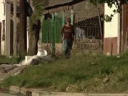 MS Man walking on town road / Buenos Aires, Argentina Stock Footage