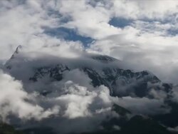 T/L with camera move, cloud over Annapurna III, Himalayas Stock Footage