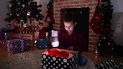Surprised child opening and looking inside a magic gift Stock Footage