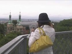 Couple observing Prag with telescope Stock Footage