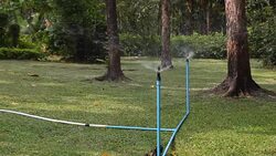 Water sprinkler showering grass.  Part 3 Stock Footage