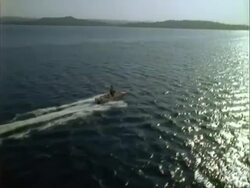 Aerial over motor boat on water.  Panama. Stock Footage