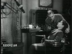 1900s: DRAMATIZATION: TURN OF THE CENTURY: Boy in dentist chair w/ dentist looking in mouth, telling boy good dentist has to hurt. LA Dentist leg & foot operating pedal powered dental drill, VO boy making pain noises. Elder male sitting in waiting roo Instructional Video