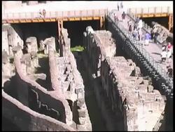 Italy: Rome Colosseum, Coliseum Interior incl. Underground Hypogeum. Pull Stock Footage