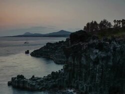 WS T/L View of Landscape of Coastal Feature at Jusangjeolli ( spectacular volcanic rock formation at southern coast of Jeju Island or columnar joint ) / Jejudo, South Korea Stock Footage