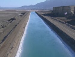 Aerial Dead sea water canal, Israel, southern Judea Desert Stock Footage