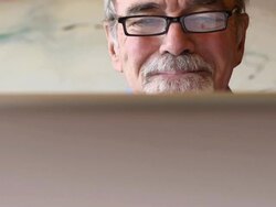 Concerned Senior Man with Computer Stock Footage