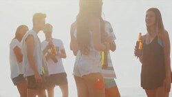 Party on the beach at sunset Stock Footage