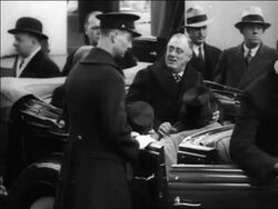 B/W 1933 Franklin Roosevelt + Herbert Hoover sitting in back of convertible / inauguration day Stock Footage